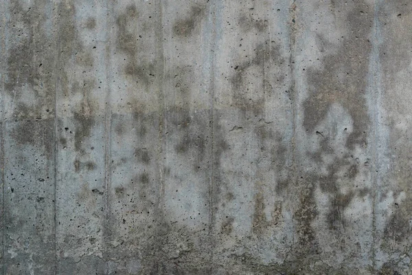 Texture of old reinforced concrete surface. Flat reinforced concrete surface with traces of wooden formwork, covered with dark spots, background, high resolution.