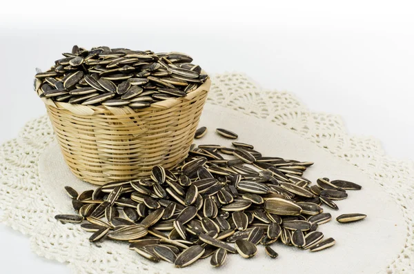 Sunflower seed with bamboo bucket — Stock Photo, Image