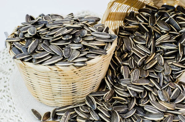 Sunflower seed with bamboo bucket — Stock Photo, Image