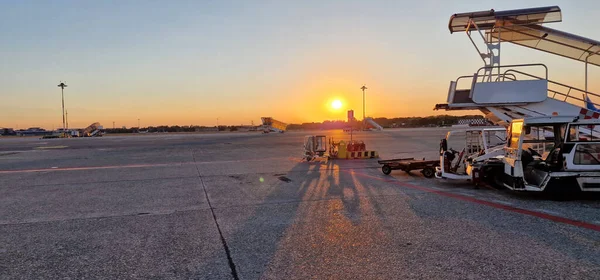 deserted airport runway at sunset