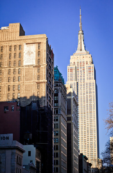NEW YORK CITY - JAN 6: City Streetscene 5th av with an Empire State Building on background. January 9, 2011 in Manhattan, New York City.