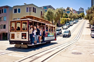 Passengers enjoy a ride in a cable car clipart