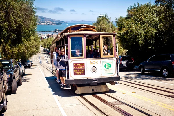 Passengers enjoy a ride in a cable car — Stock Photo, Image