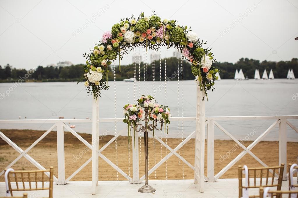 Wedding floral arch on the beach