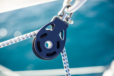 Closeup on yacht cord crank, rope holder clipart