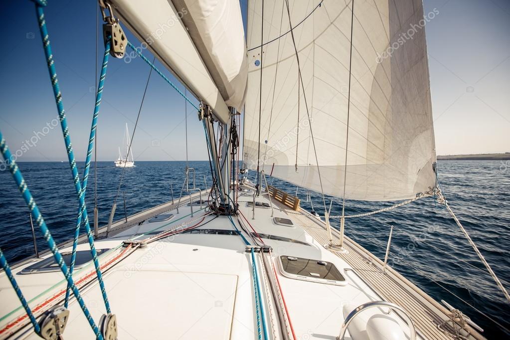 Sailing ship yachts with white sails