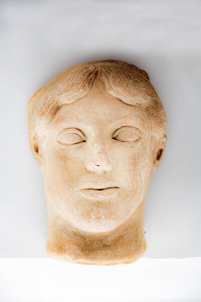 Head Statue of Greek unknow person on white background, in Italy
