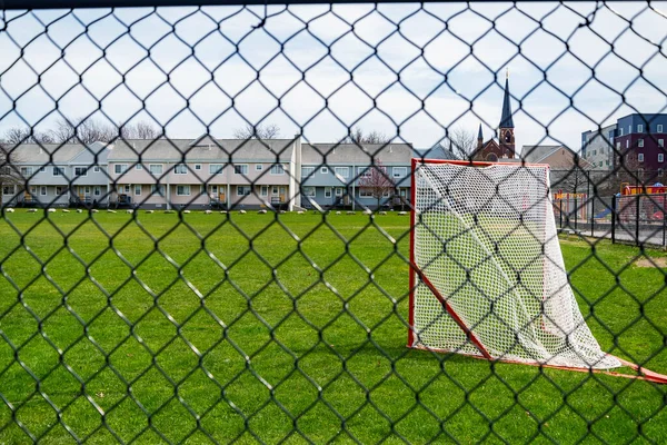 a lacrosse goal on a grass field in Porlanad, Maine, USA
