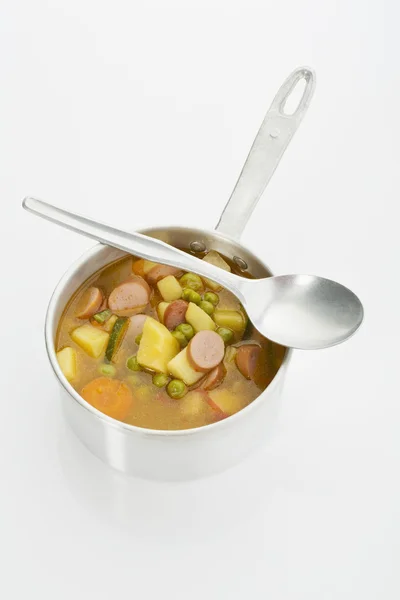 Pan with vegetable soup and vienna sausages — Stock Photo, Image