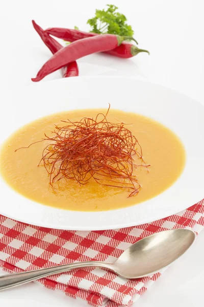 Carrot-celery-soup with strings of chili — Stock Photo, Image