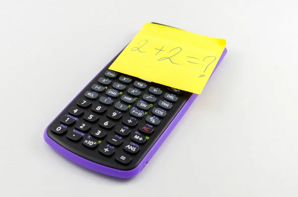 Calculator and sticky note — Stock Photo, Image