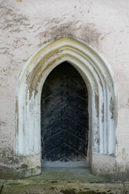 Old door of a entrance to church. Old door design.