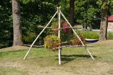 Decoration with flowers pots near the castle in Latvia.