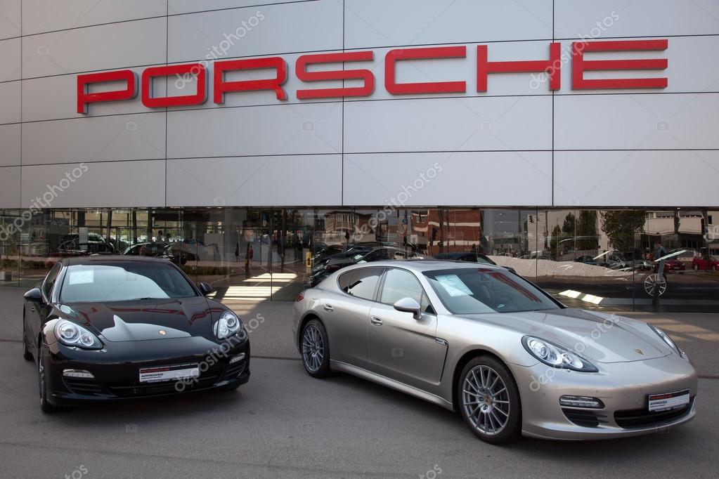Stuttgart, Germany - September 4, 2012: Porsche Panamera sports cars in front of a Porsche dealer in Stuttgart Zuffenhausen. Porsche is a German company with investm