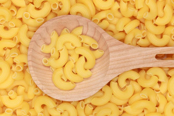 Pasta on a wooden spoon — Stock Photo, Image