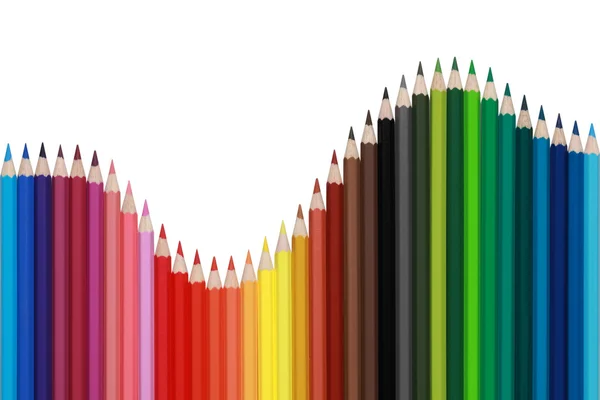 Colored pencils forming a wave — Stock Photo, Image