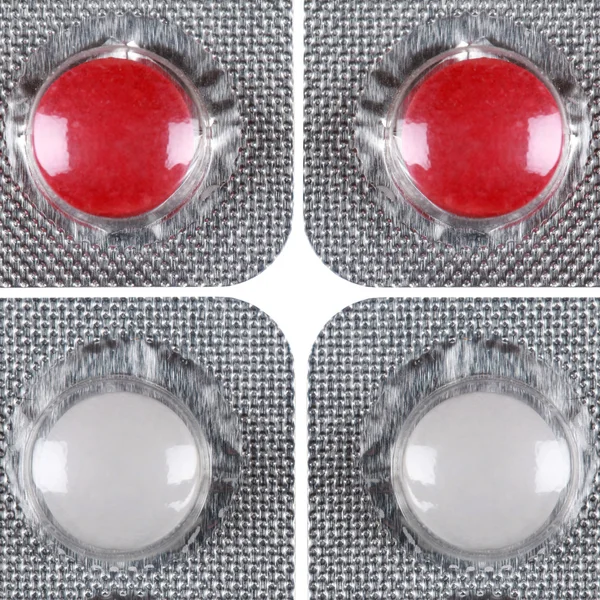 Pílulas vermelhas e brancas em uma bolha — Fotografia de Stock