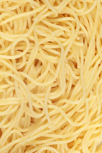 Cooked spaghetti forming a background — Stock Photo, Image