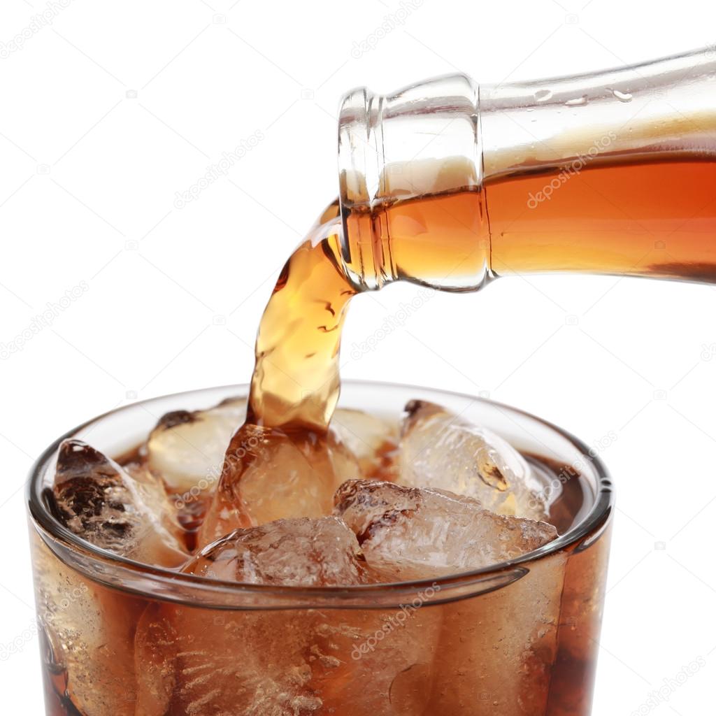 Cola pouring into a glass, isolated