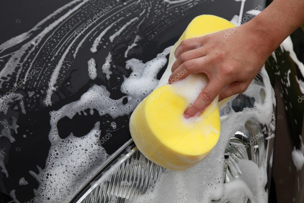 Washing a car with a sponge — Stock Photo © Boarding2Now 28739381