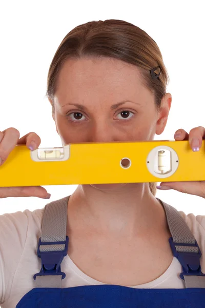 Young woman holding a spirit level — Stock Photo, Image