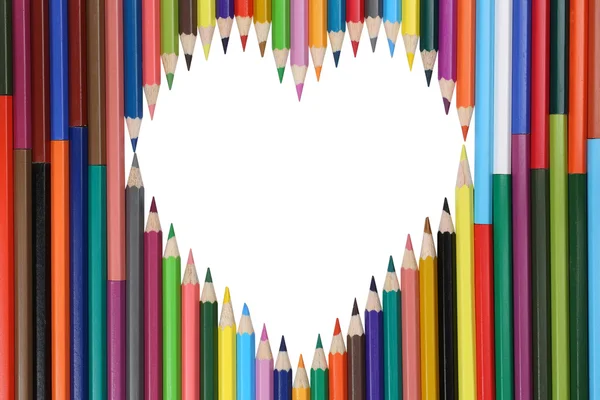 Colored pencils forming a heart love topic — Stock Photo, Image