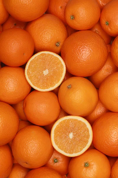 Laranjas formando um fundo de frutas — Fotografia de Stock