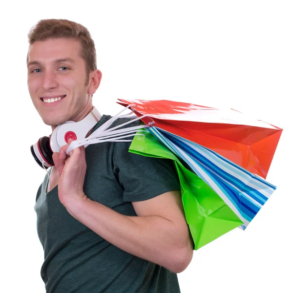 Przypadkowy mężczyzna z słuchawki i torby na zakupy — Zdjęcie stockowe