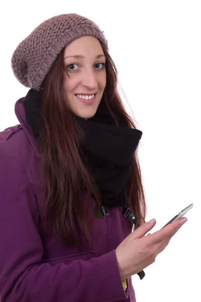 Giovane donna in inverno con un telefono cellulare — Foto Stock