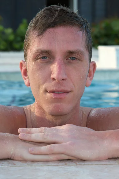 Young man at swimming pool — Stock Photo, Image