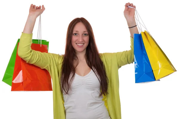 Mujer joven feliz con bolsas de compras que se divierten mientras compras —  Fotos de Stock