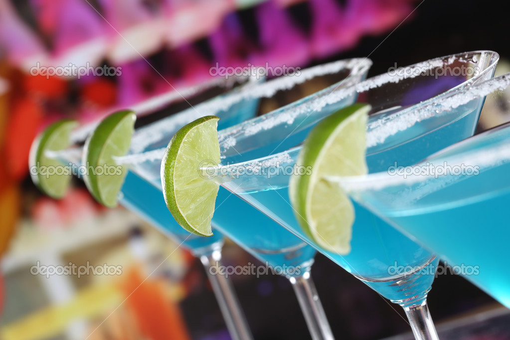 Blue Curacao Cocktails in Martini glasses in a bar Stock Photo by