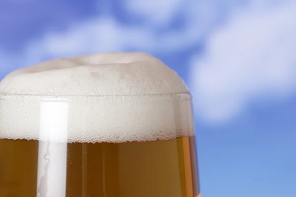 Beer in a glass in beergarden — Stock Photo, Image