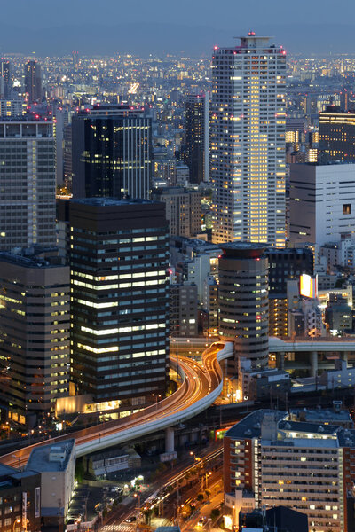 Osaka Japan city skyline and downtown skyscrapers illuminated at night
