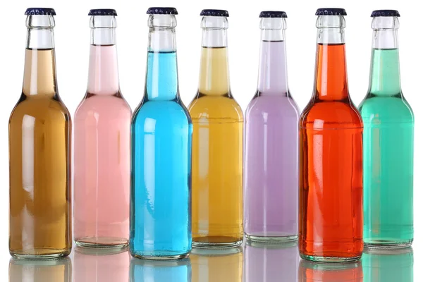 Colorful soda drinks with cola in bottles Royalty Free Stock Images