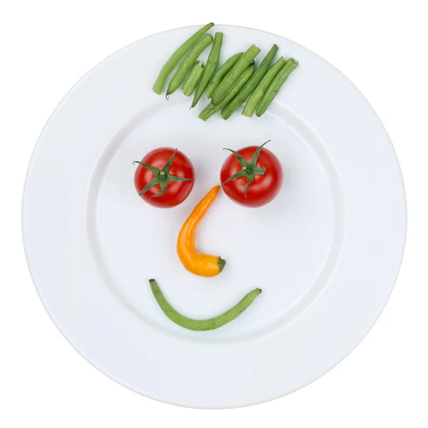 Cara sonriente de verduras en plato aislado — Foto de Stock