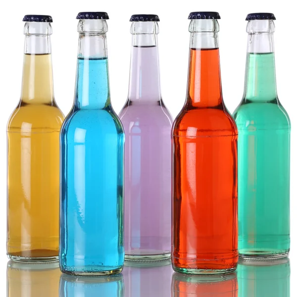 Colorful soda and soft drinks in bottles with reflection — Stock Photo, Image