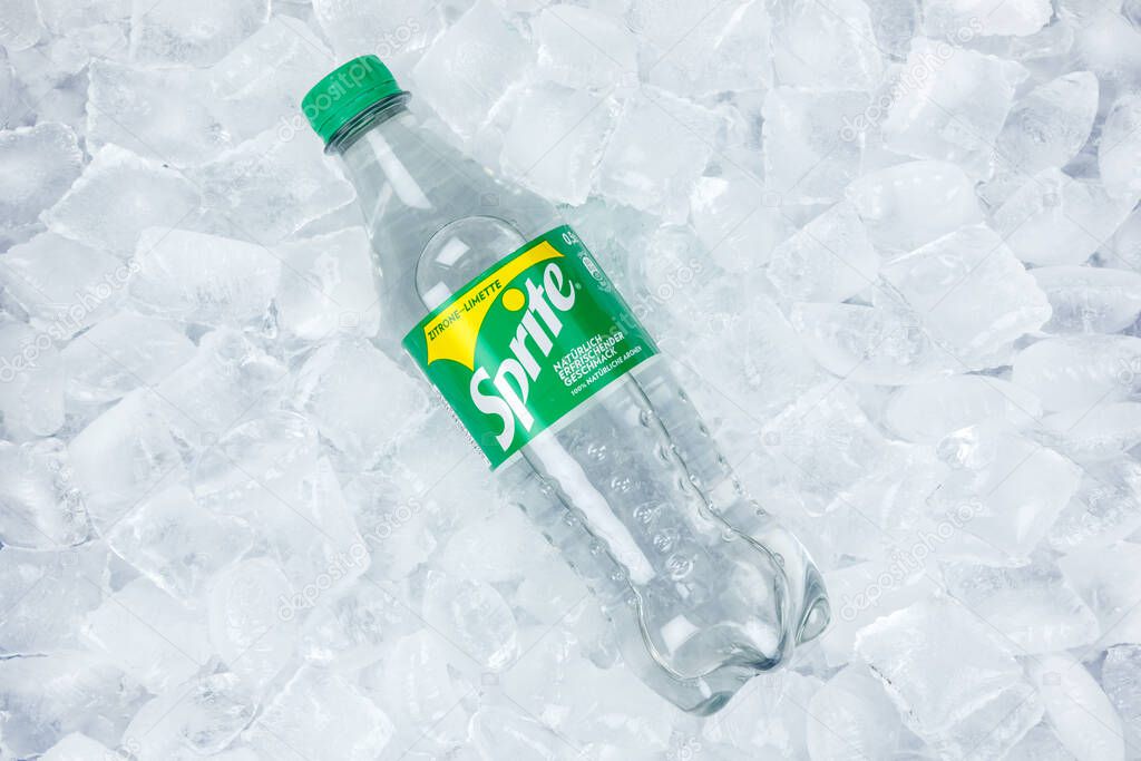 Stuttgart, Germany - August 31, 2021 Sprite lemonade soft drink in a plastic bottle on ice cubes in Stuttgart, Germany.