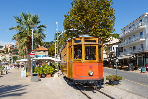 Port de Soller, Spain - October 21, 2021 Ancient tram Tranvia de Soller public transport transit traffic on Mallorca in Port de Soller, Spain.
