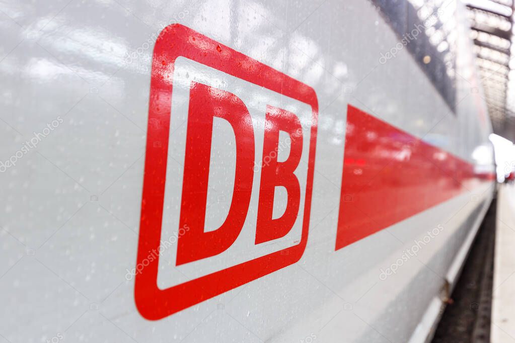 Cologne, Germany - August 3, 2021 DB logo sign on an ICE high-speed train at Cologne Kln main railway station Hauptbahnhof Hbf in Germany.