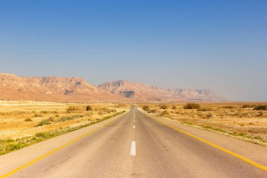 Endless road driving drive empty desert landscape copyspace copy space infinite distance travel clipart