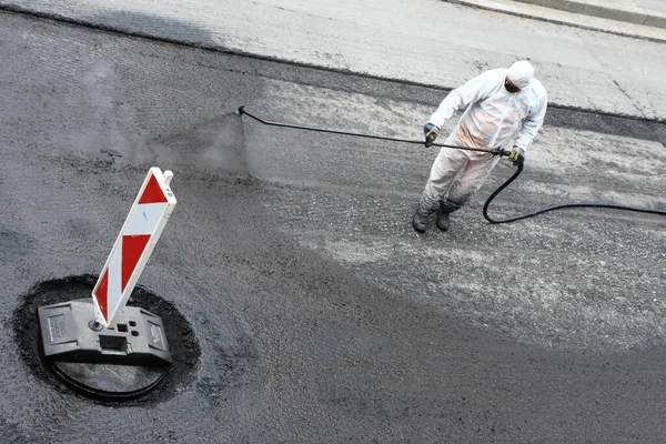 Worker White Protective Overall Spraying Road Surface Liquid Bitumen — Stock Photo, Image