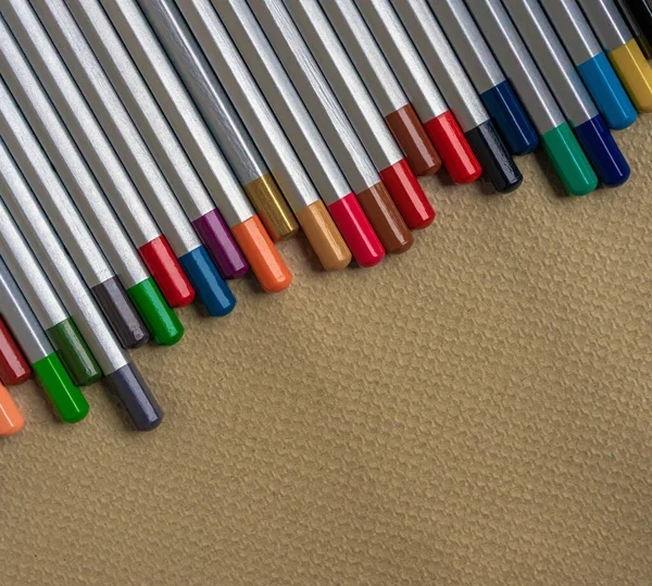 Row Colored Pencils Embossed Paper Copy Space — Stock Photo, Image