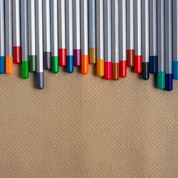 Row Colored Pencils Embossed Paper Copy Space — Stock Photo, Image