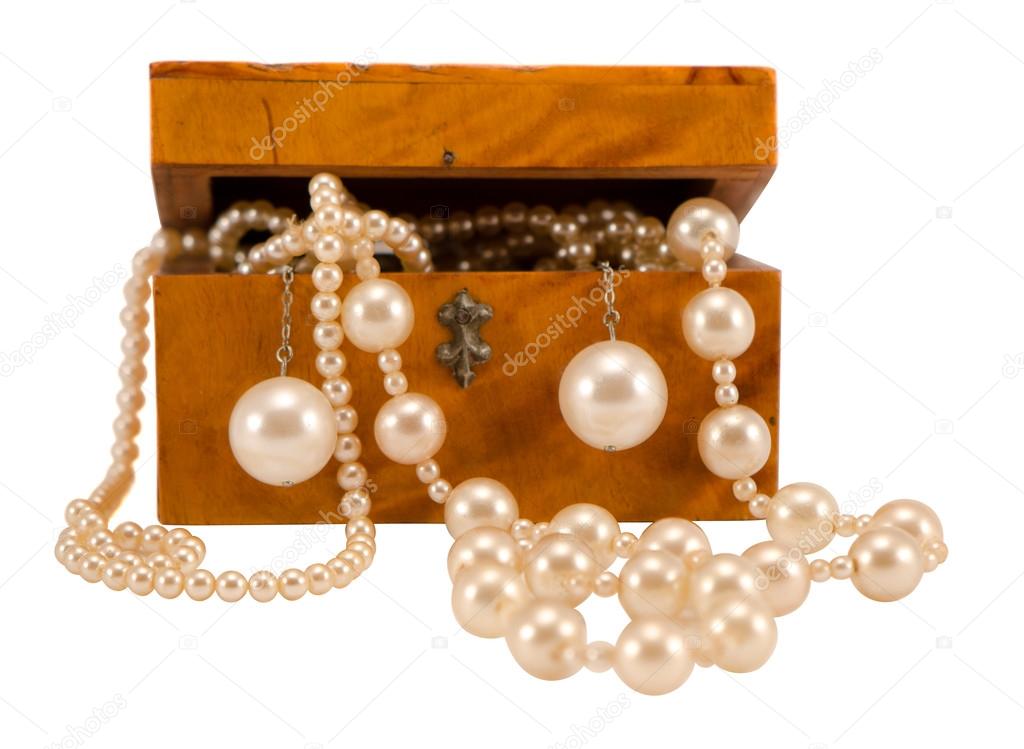 Pearl jewelry in retro wooden box isolate on white