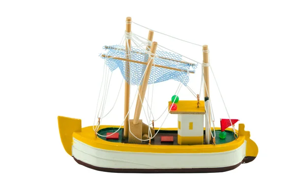 Wooden handmade boat ship model on blue background — Stock Photo