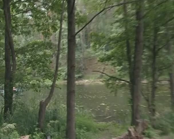 Men and women caught by rain in boat when sailing along river. — Stock Video