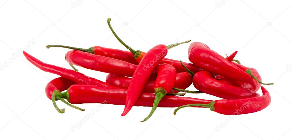 Pile natural red chilli peppers paprika on white