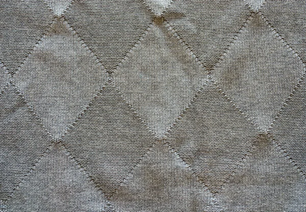 Knitted wool pattern rhomb form grey background — Stock Photo, Image