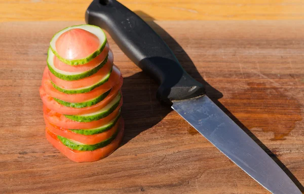 Sliced tomato cucumber knife — Stock Photo, Image